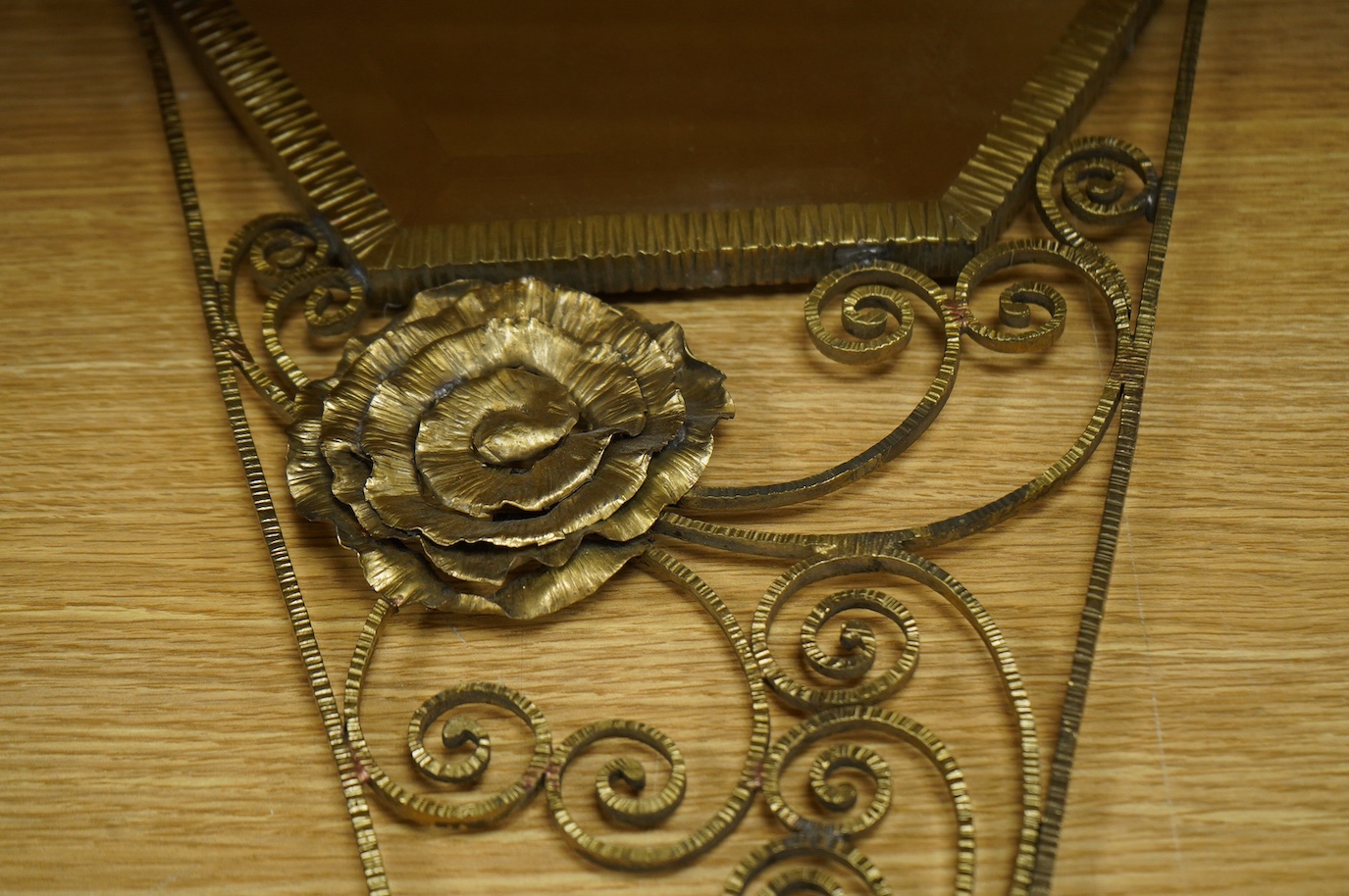 A decorative French gilt metal mirror, 67cm high. Condition - fair/good